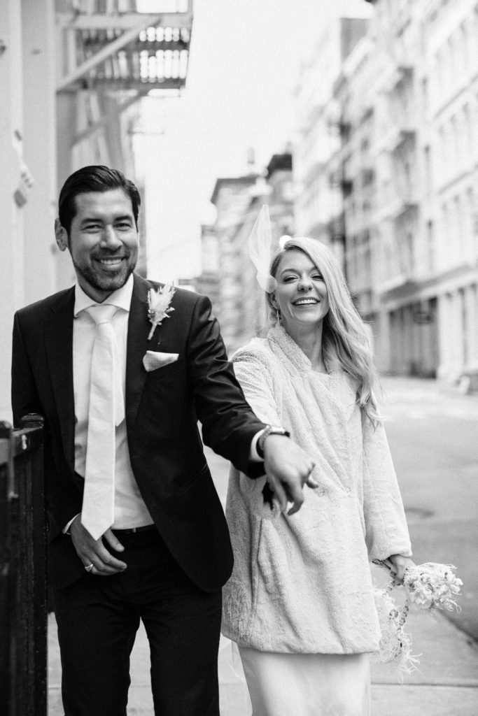 Bride and groom outside the Soho Grand by NYC city hall wedding photographer