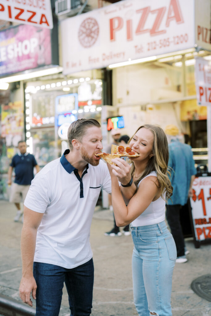 couple eating street pizza together