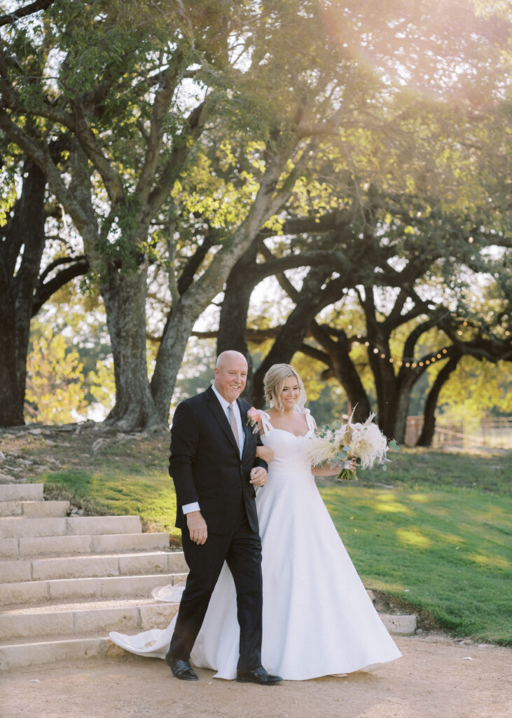 bride and father of the bride walking the aisle at fort worth wedding venues
