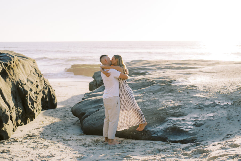 Couple on beach photographed by San Diego Engagement Photographer