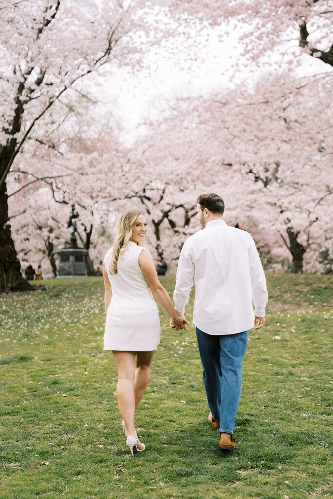 Couple in the park enjoying cherry blossom season