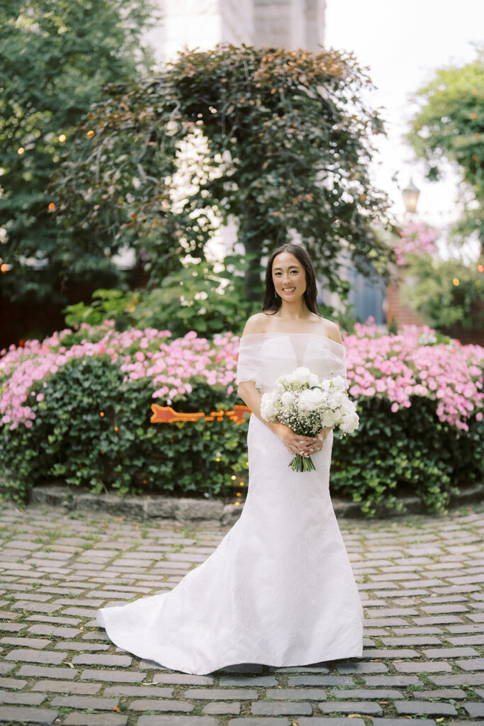Bride at The River Cafe Brooklyn Wedding holding her bouquet