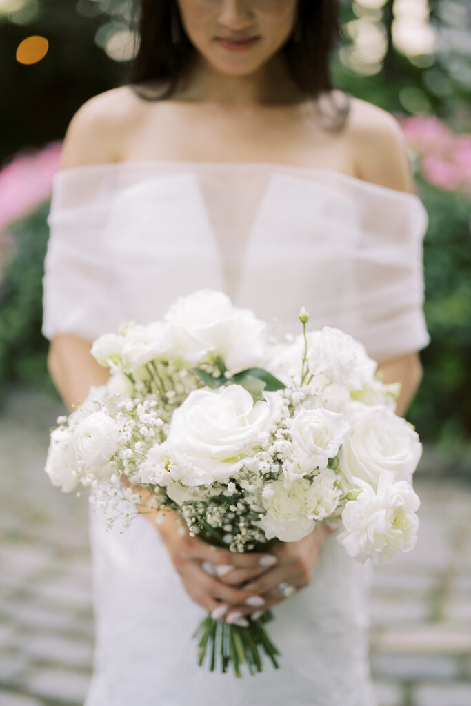 Bride at The River Cafe Brooklyn Wedding holding her bouquet