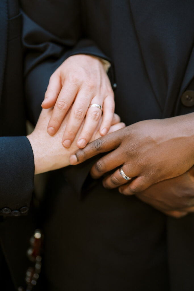 Newlyweds with rings at The 1909 Wedding in Topanga Canyon